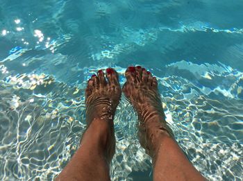 Low section of woman in swimming pool