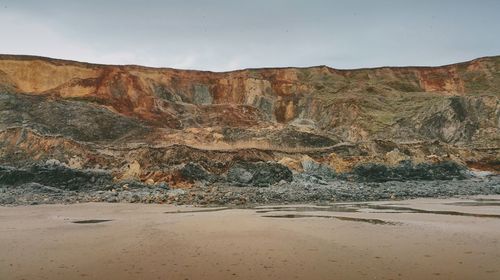 Scenic view of cliff against sky