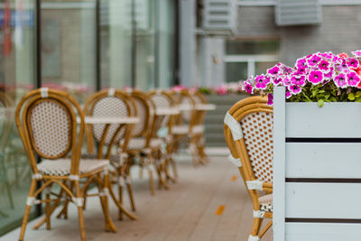 Empty chair on table by building