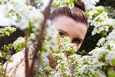 Portrait of woman with plants