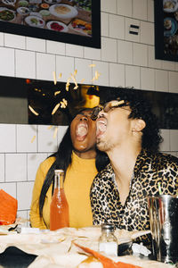 Young couple with food on table