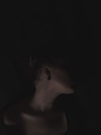 High angle view of shirtless man in darkroom