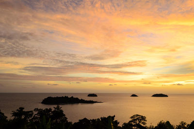 Scenic view of sea against orange sky