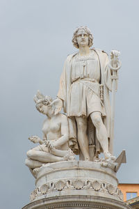 Low angle view of statue against sky