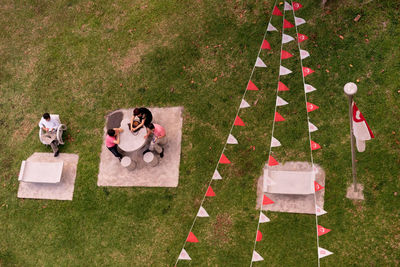 People on grassy field