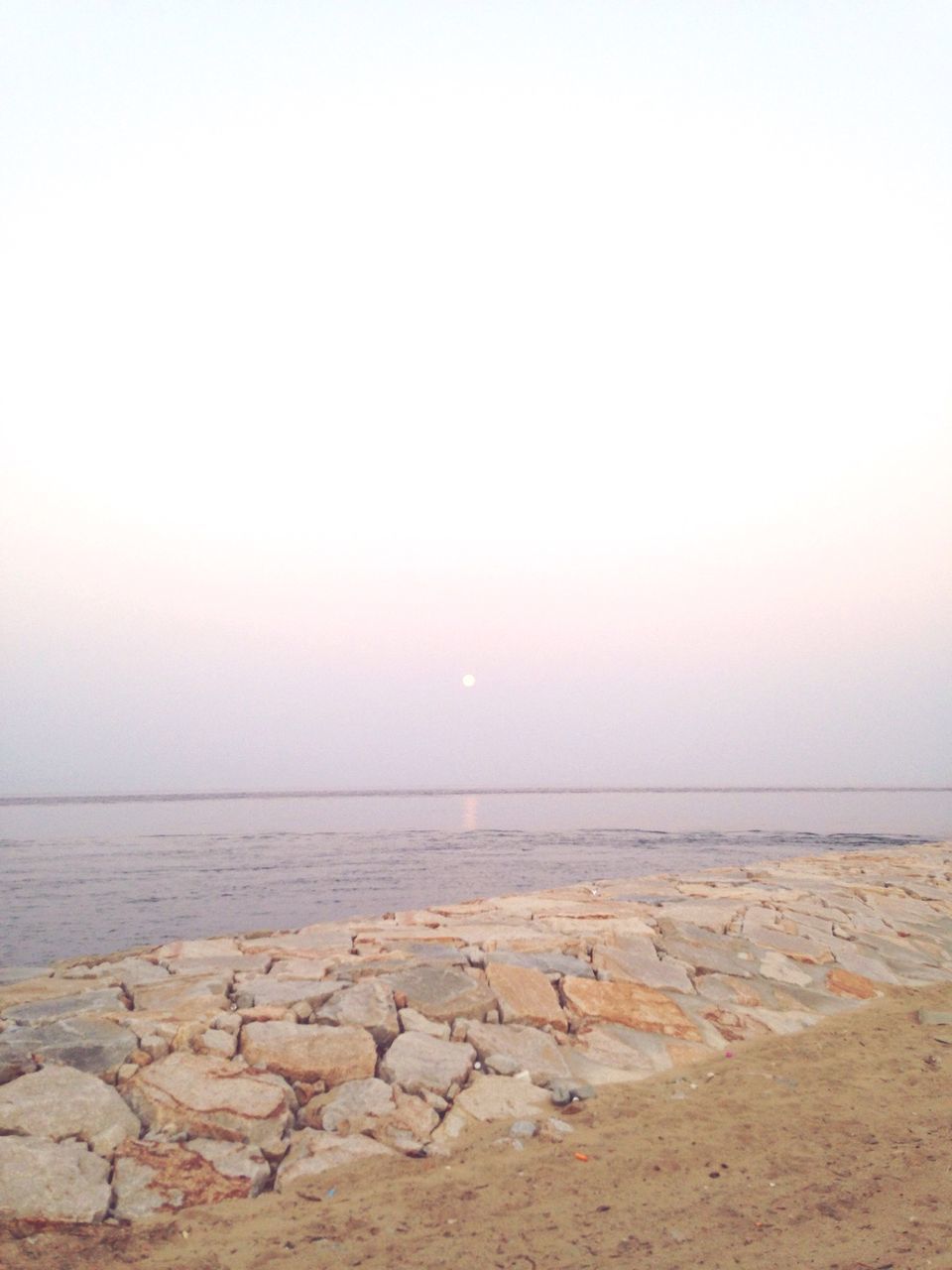 sea, horizon over water, beach, water, tranquil scene, scenics, shore, tranquility, beauty in nature, clear sky, copy space, nature, sand, sky, idyllic, sunset, remote, coastline, calm, outdoors