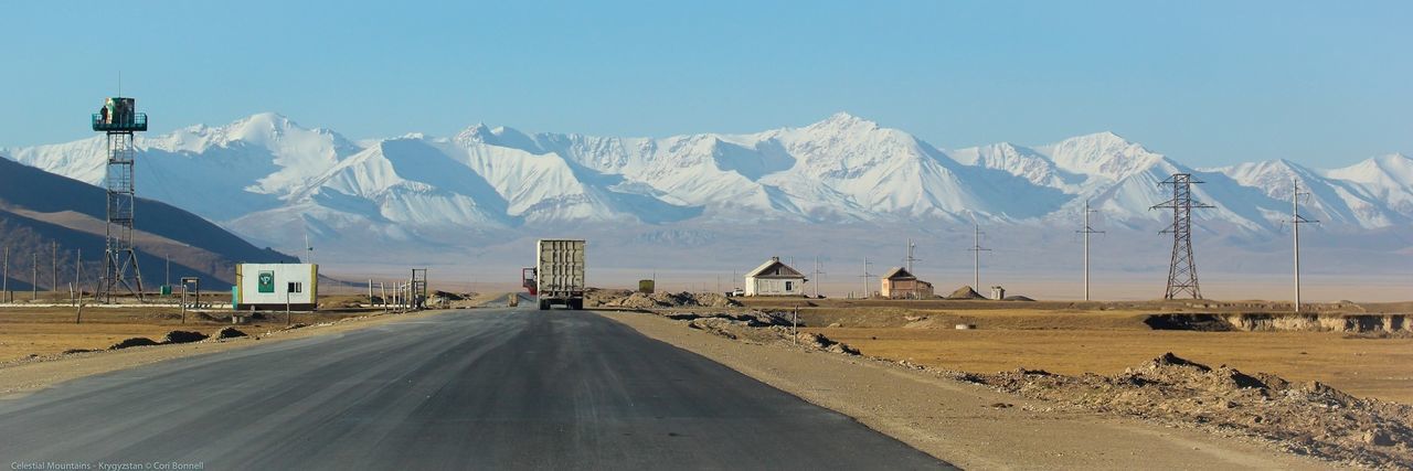 mountain, snow, winter, mountain range, cold temperature, the way forward, transportation, road, snowcapped mountain, clear sky, landscape, built structure, season, building exterior, architecture, tranquil scene, sky, tranquility, nature, empty