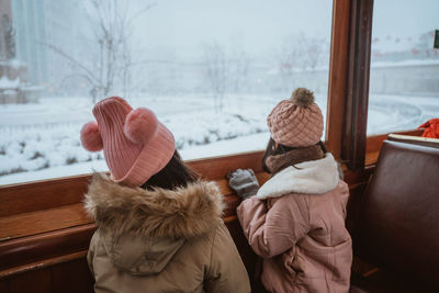 Rear view of people sitting in bus