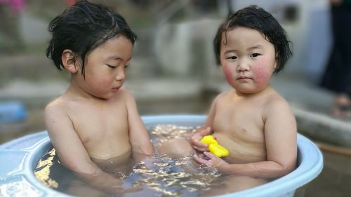 Close-up of baby boy playing in water