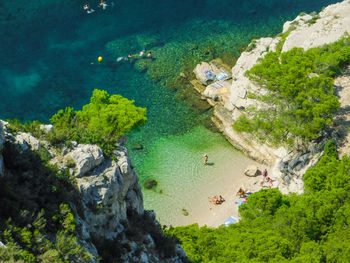 High angle view of rocks and sea