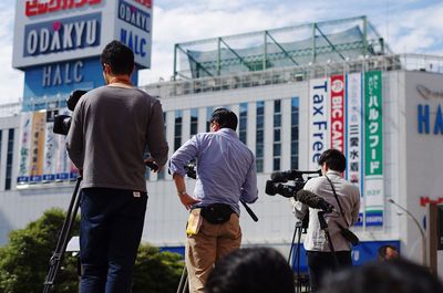 Rear view of photographers