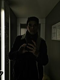 Portrait of a young man using smart phone