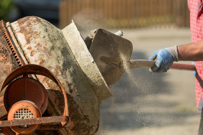 Midsection of construction worker working at site