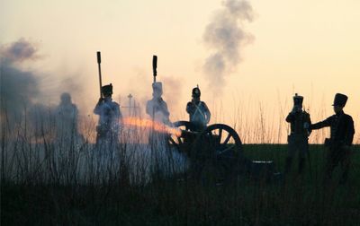 Shooting with old cannon by soldier