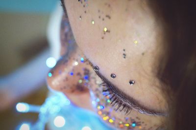 Close-up of glitters on woman face