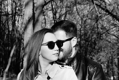 Portrait of young couple kissing outdoors