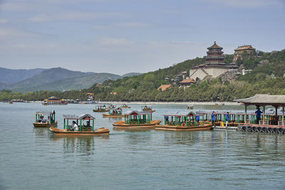 Boats in sea against sky