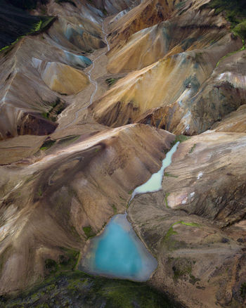 High angle view of water flowing through rocks