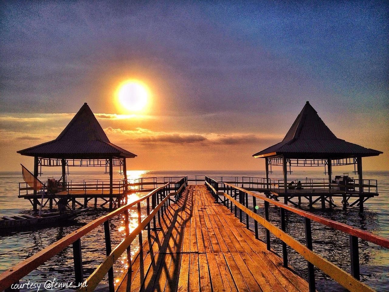 sea, water, horizon over water, sunset, tranquility, tranquil scene, pier, scenics, beach, sky, beauty in nature, gazebo, jetty, nature, wood - material, idyllic, railing, shore, sun, the way forward