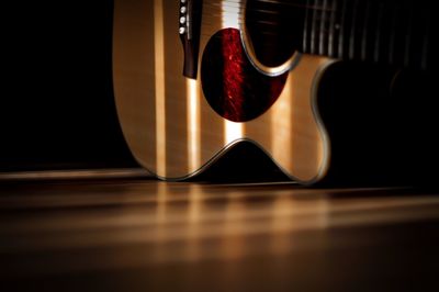 Surface level of guitar on wooden table