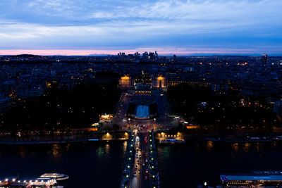 High angle view of city lit up at dusk