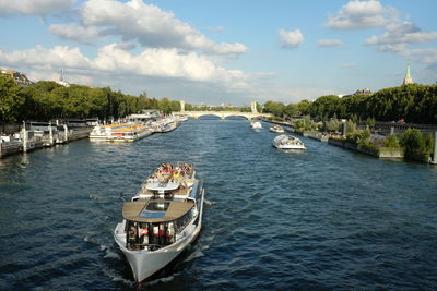 Ferry boat in seine river against sky