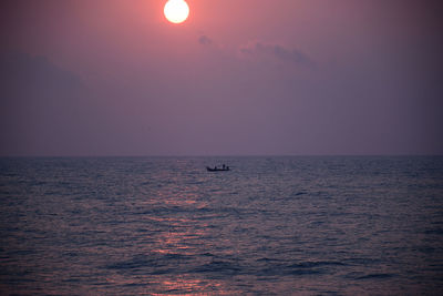 Scenic view of sea at sunset