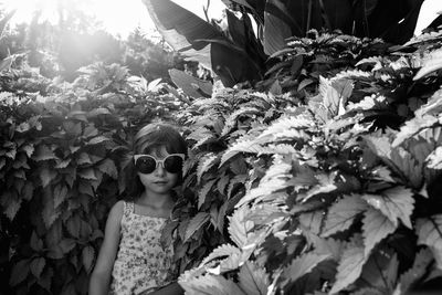 Girl amidst plants at park