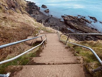 High angle view of footpath amidst rocks