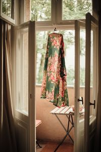 Dress drying on doorway of balcony