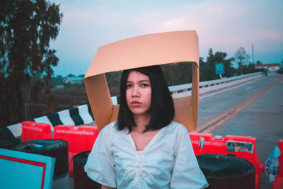 Portrait of woman looking away while sitting in car