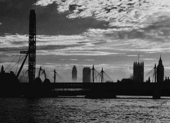 Silhouette of bridge over river