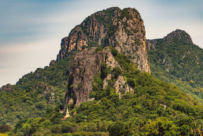 Rock formation on mountain against sky