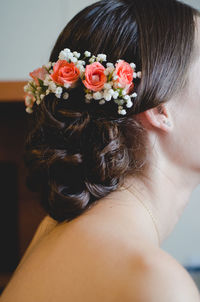 Close-up of woman wearing flowers