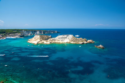 Scenic view of sea against clear blue sky