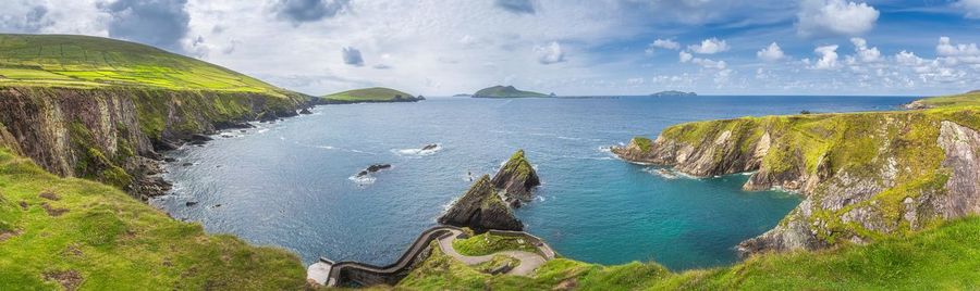 Dunquin pier and harbour with tall cliffs, turquoise water and islands, wild atlantic way, ireland