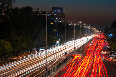 High angle view of light trails on road at night