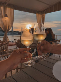 Cropped hand of woman holding wineglass