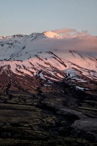 Scenic view of mountains against sky during winter