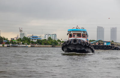 A tugboat at the chao phraya river in bangkok thailand southeast asia