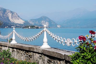 Scenic view of sea and mountains against sky