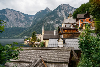 High angle view of houses and mountains against sky