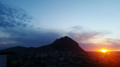 Scenic view of mountains against sky during sunset