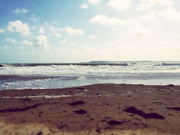 Scenic view of beach against sky