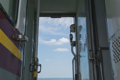 Low angle view of train against sky