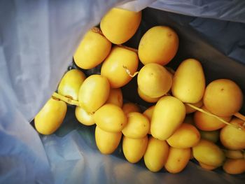 High angle view of oranges in container