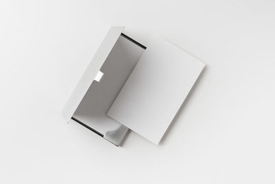 High angle view of paper on white table