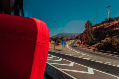 Road by mountain against clear sky