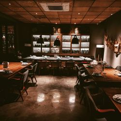 Empty chairs and tables in restaurant