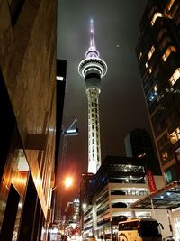 Low angle view of skyscraper at night